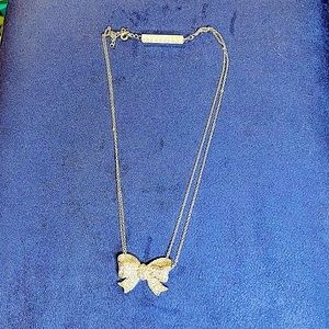 Silvertone rhinestone bow necklace